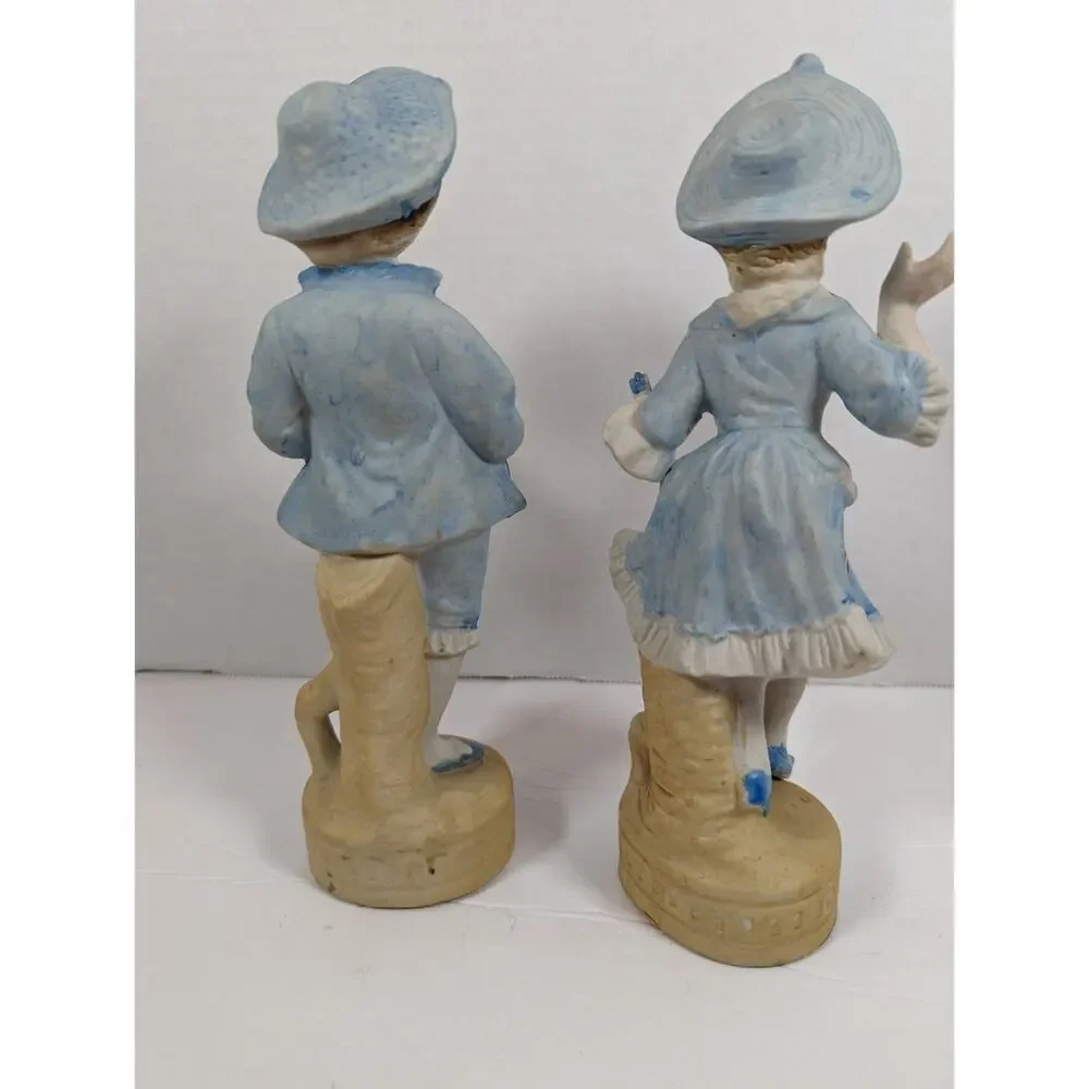 Vintage L & M INC. 8 1/2 '' TALL SET OF TWO BISQUE FIGURINES BOY & GIRL IN BLUE